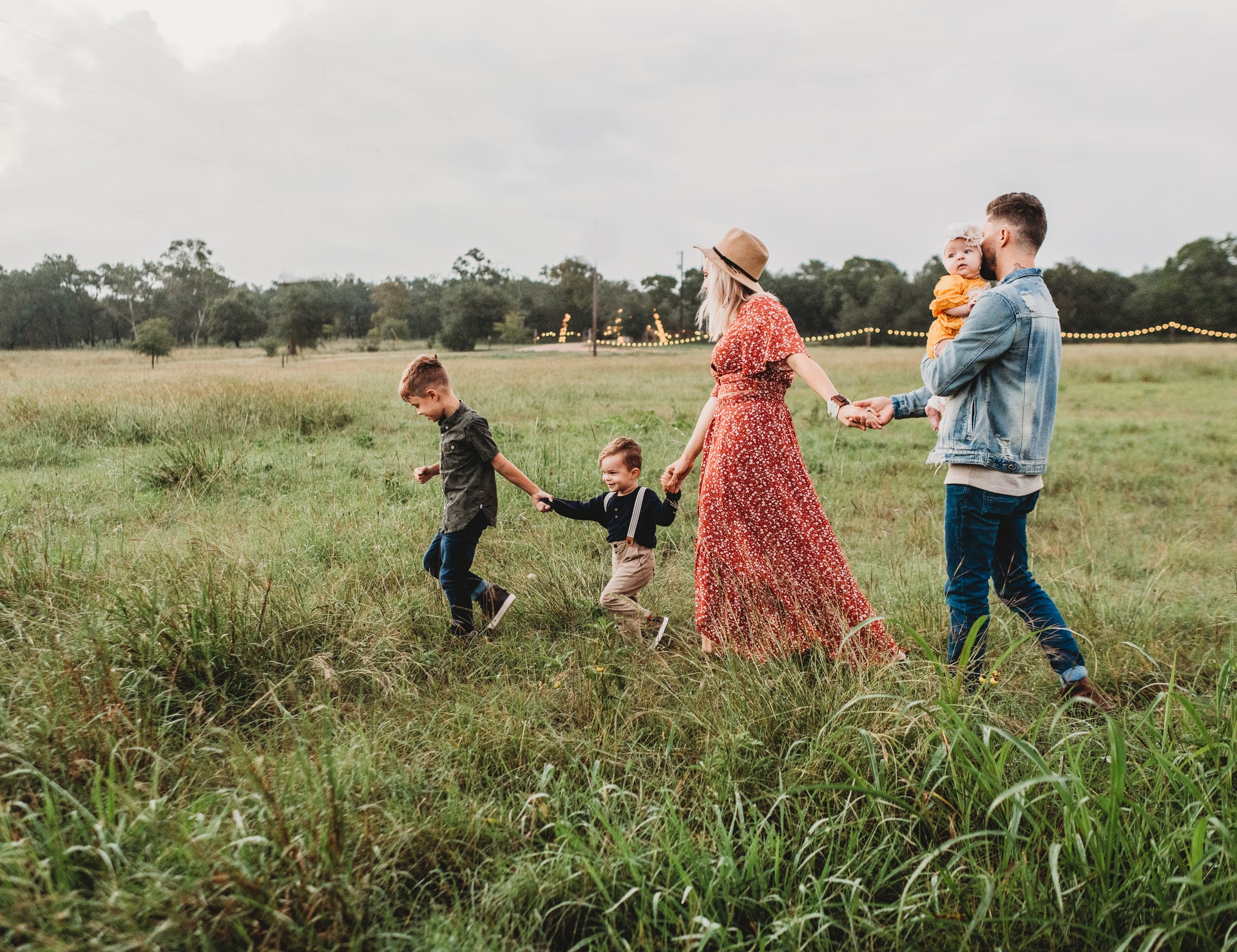 family walking through a field
